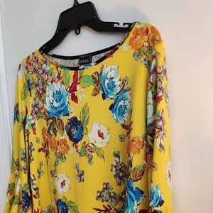 Yellow multi floral top with bell sleeves. All piped with black edge Size L
